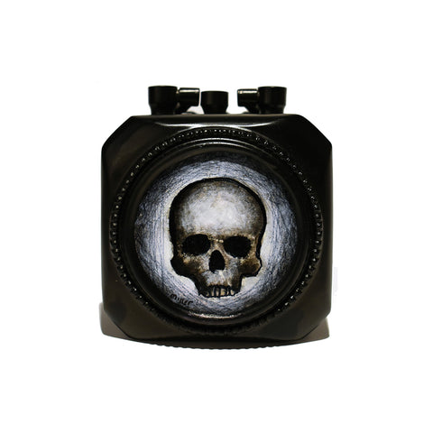 Image of Skull in Metal Clock Frame by Justin D. Miller